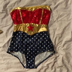 Wonder Woman Halloween costume. Size medium. New with tags. Cape, bodysuit, etc.